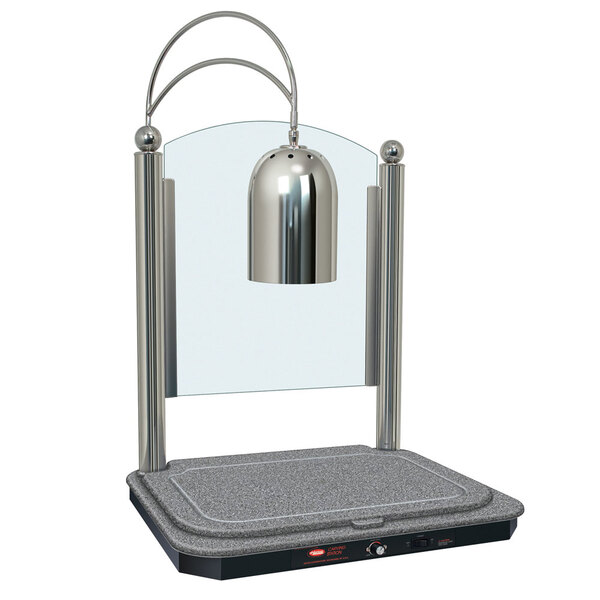 A Hatco carving station with a silver lamp on a grey surface.