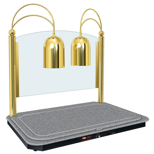 A Hatco carving station with a bright brass heated base and gold lamp stands.