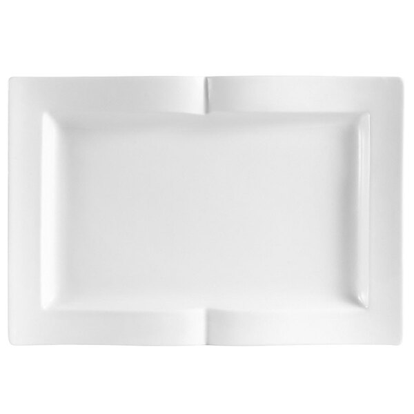 A white rectangular china serving platter with a curved corner.