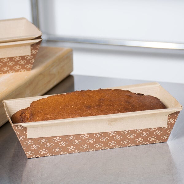 A loaf of bread in a rectangular paper container.