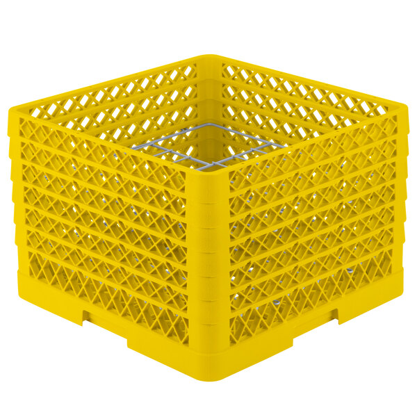 A yellow plastic Vollrath Plate Crate with 12 compartments and holes.
