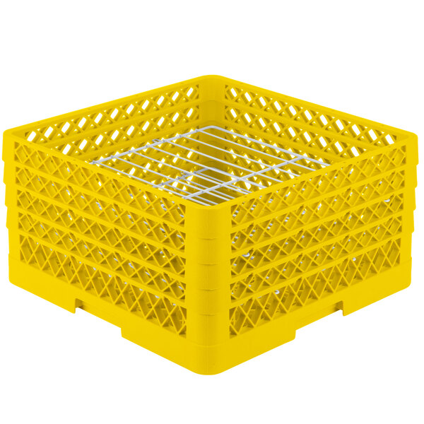 A yellow plastic Vollrath Traex plate rack with metal wire grates.