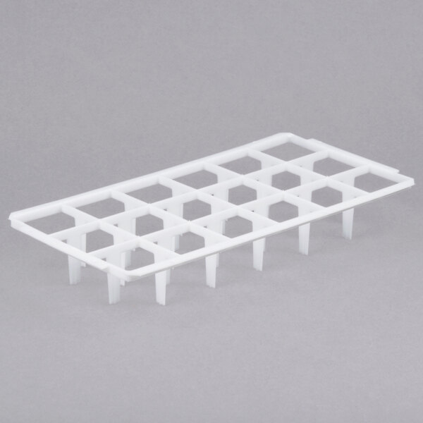 A white plastic grid tray with 18 rows of holes.