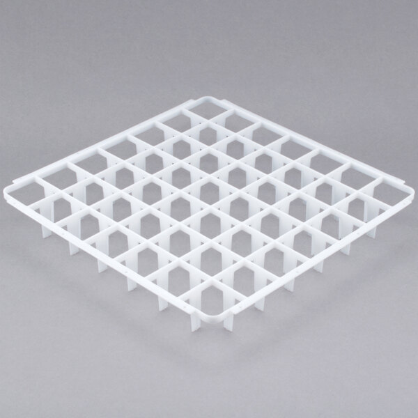 A white plastic Vollrath glass rack divider with holes in it.