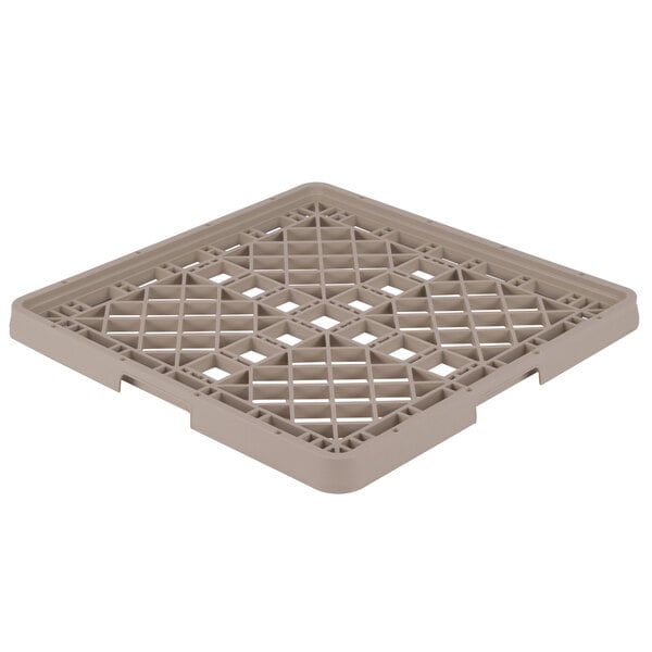 A beige plastic Vollrath Traex grid with holes.