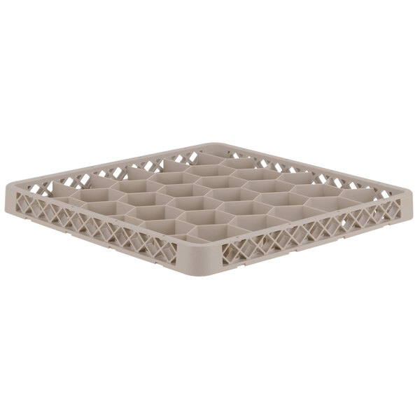 A beige plastic Vollrath Traex glass rack extender with compartments.