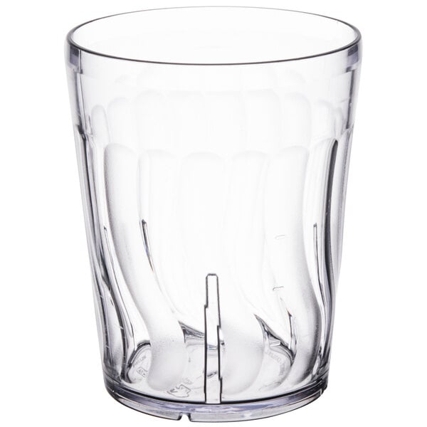 A clear Dinex plastic tumbler with a wavy design.