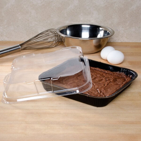 A brownie in a Solut black tray with a clear plastic lid.