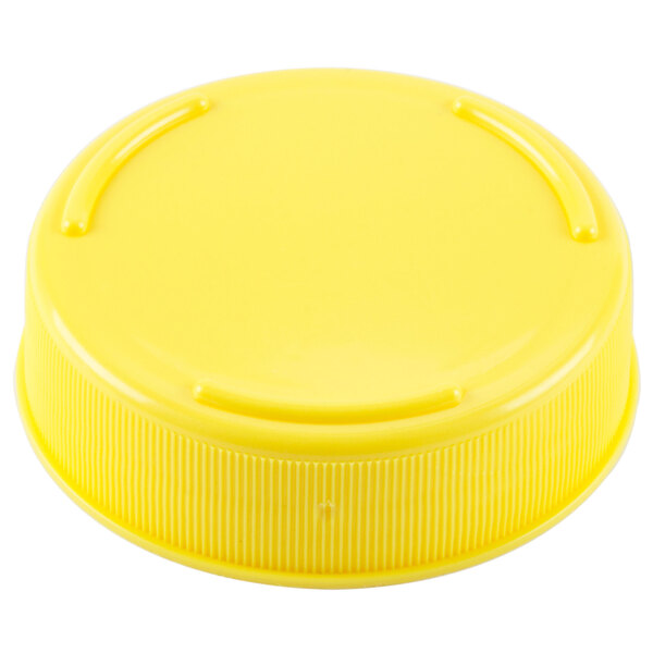 A Tablecraft yellow plastic cap for squeeze bottles with a 53 mm opening.