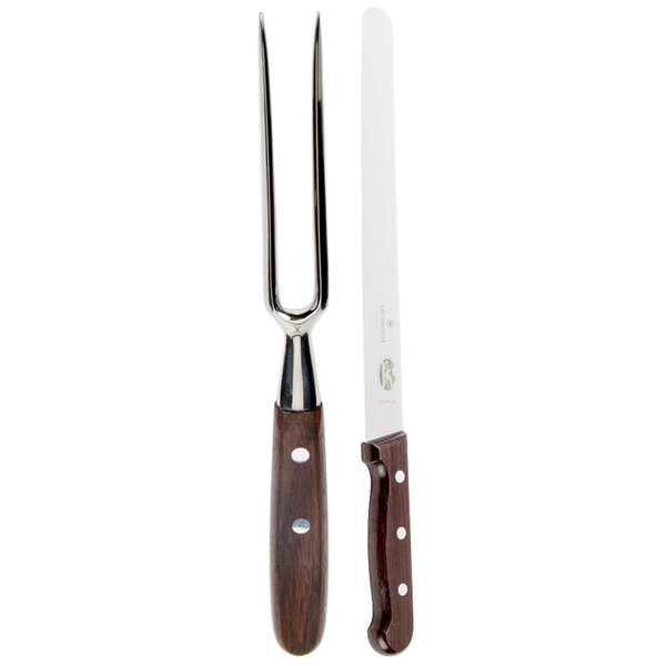 A Victorinox knife and fork with rosewood handles.