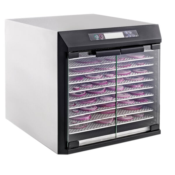 A large Excalibur stainless steel food dehydrator with trays of food inside.