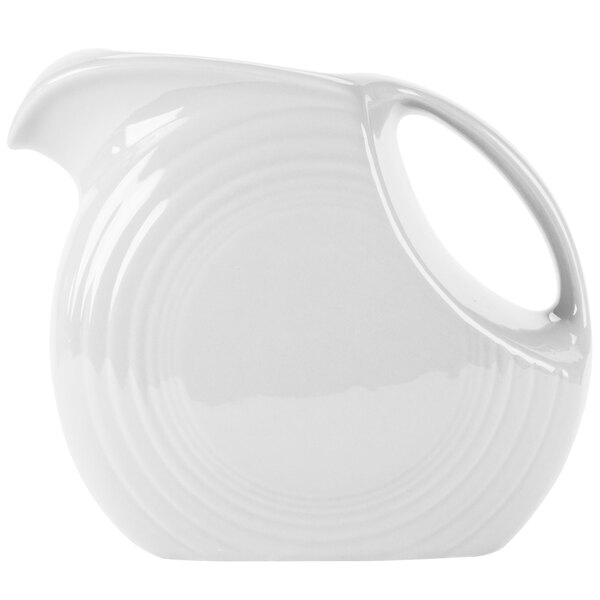 A Fiesta white china pitcher with a handle.