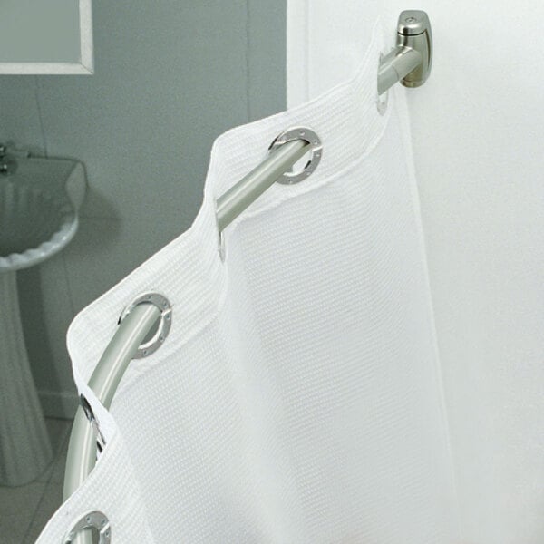 A white shower curtain on a curved metal rod.