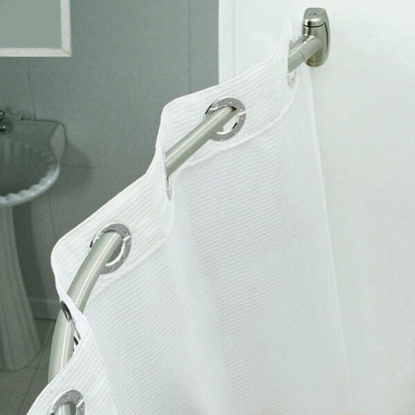 A white shower curtain from a Crescent curved metal rod.