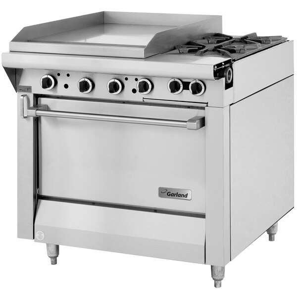 A stainless steel Garland commercial gas range with 2 burners, a griddle, and an oven.