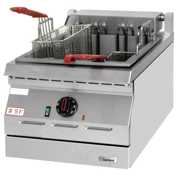 A Garland electric countertop deep fryer with two baskets and a red handle.