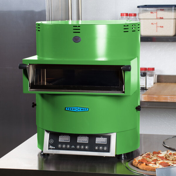 A green TurboChef Fire countertop pizza oven with a black rectangular window.