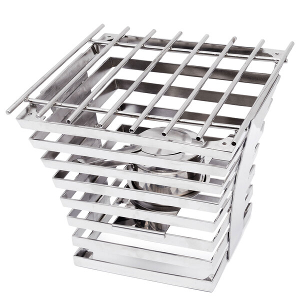 A stainless steel square riser with a metal cooking grate.