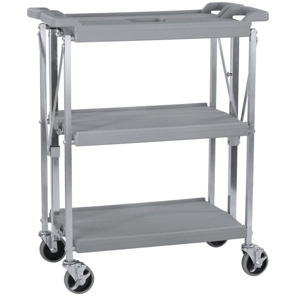 A Carlisle grey utility cart with three shelves and wheels.
