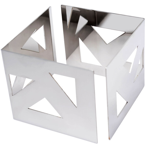 A silver metal object with cut out shapes on the corners.