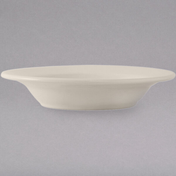 A close up of a Tuxton eggshell white china bowl.