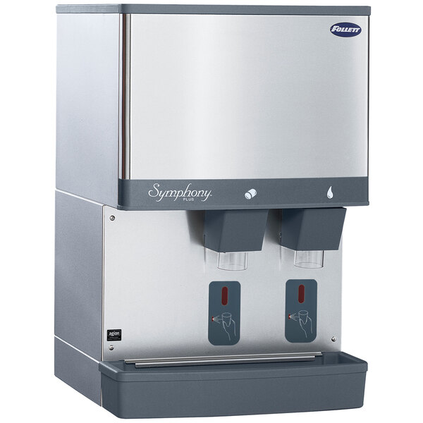 A silver and grey Follett countertop water cooled ice maker and water dispenser.