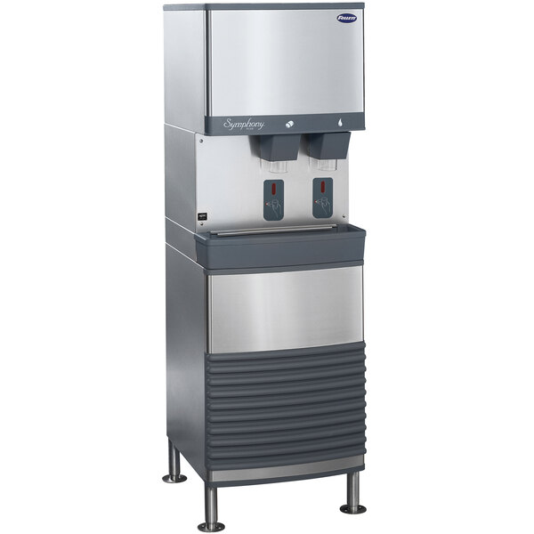 A silver and black Follett 25 Series water cooled freestanding ice and water dispenser with two dispensers.
