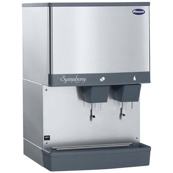 A white Follett countertop ice machine with two water dispensers.
