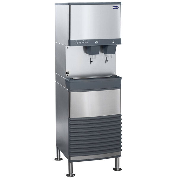 A silver rectangular Follett water and ice machine with two water dispensers.