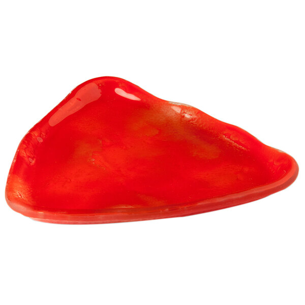 A red triangular glass plate on a white background.