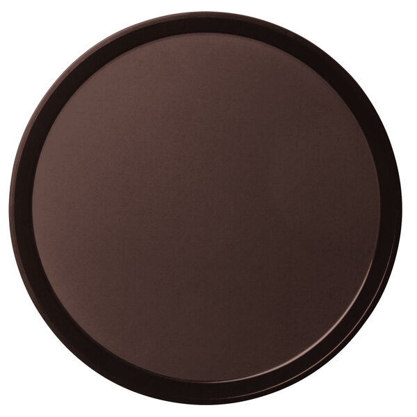A brown round non-skid serving tray with a textured surface.