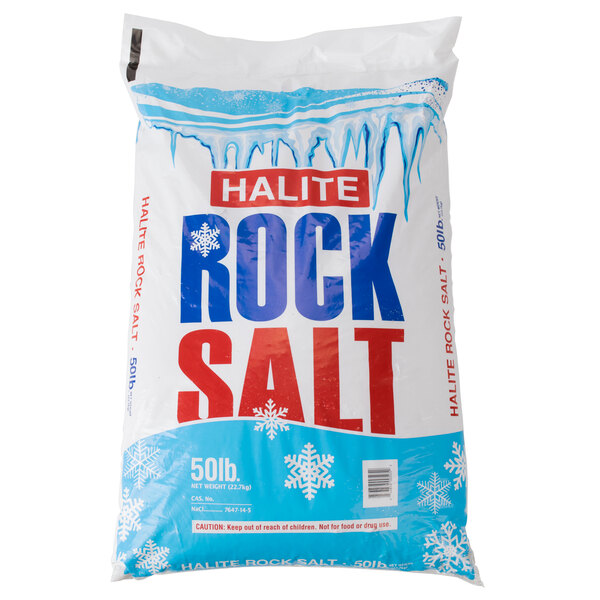 A white bag of The Cope Company Halite Rock Salt with snow and icicles on it.