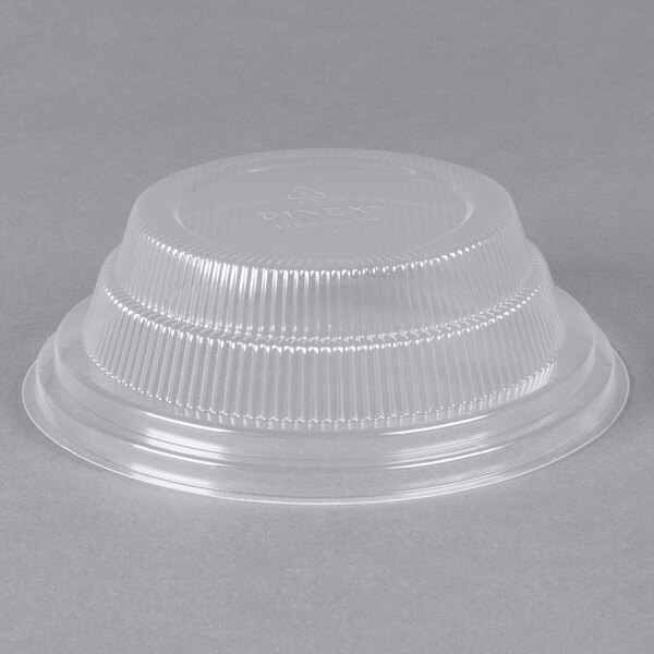 A clear plastic lid on a clear plastic bowl.