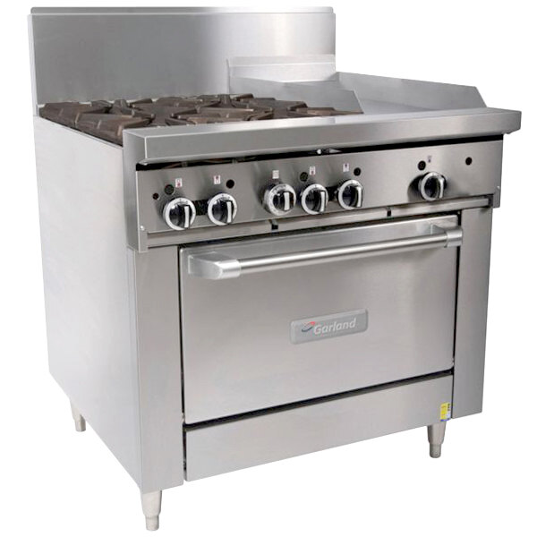 A large stainless steel Garland commercial range with 4 burners, a griddle, and an oven.