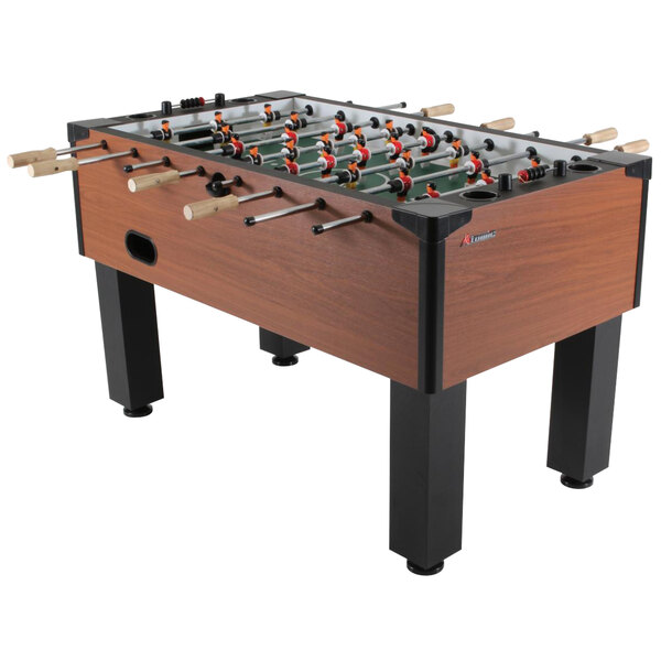 An Atomic Gladiator foosball table with four legs.