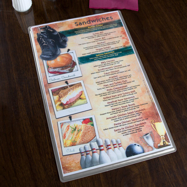 A silver Hamilton heat sealed menu board on a table.