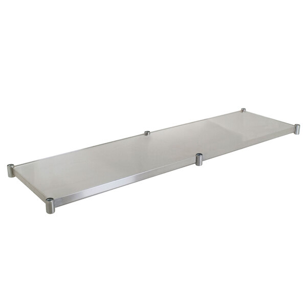 A stainless steel adjustable undershelf for an Eagle Group work table.