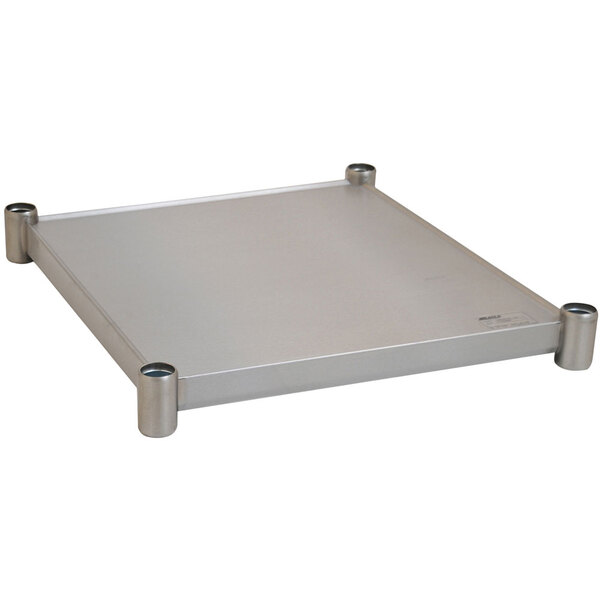 A stainless steel undershelf for an Eagle Group work table with metal rods.