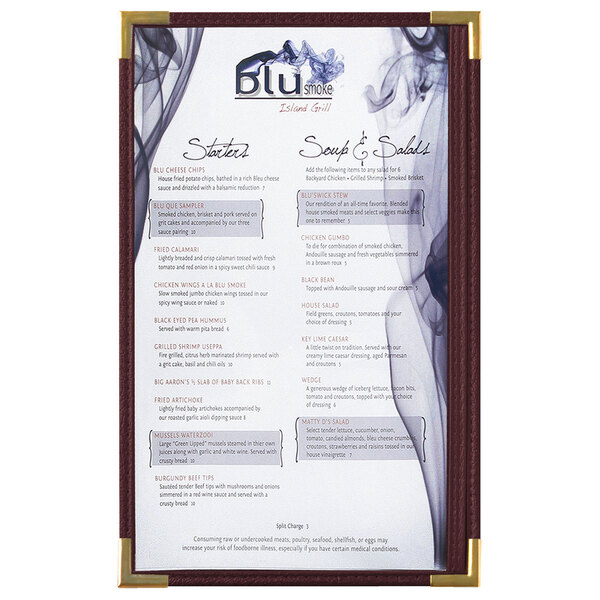 A Royal Menu Solutions burgundy menu board with gold corners on a counter with a menu showing smoke and text.