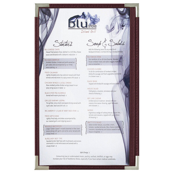 A Royal Menu Solutions menu board with silver corners and burgundy panels on a counter displaying a menu with smoke on it.