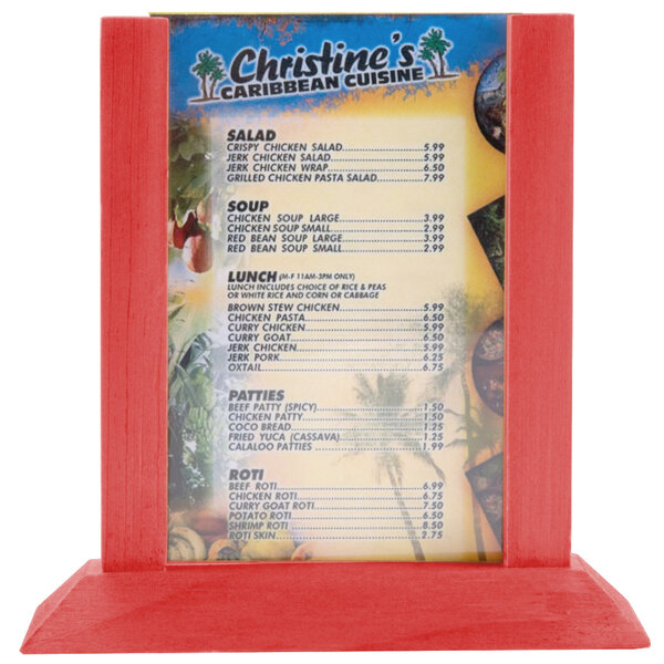 A Menu Solutions wood table tent with a menu on a red surface.