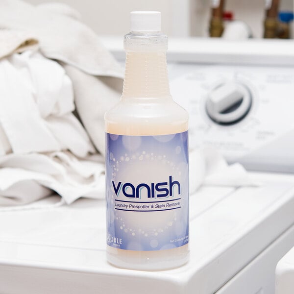 A bottle of Noble Chemical Vanish laundry pre-spotter on top of a washer.