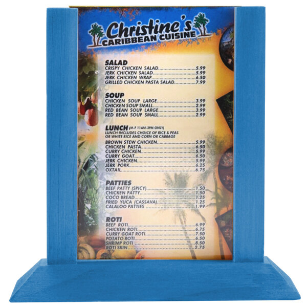 A Menu Solutions wood table tent in true blue holding a menu on a table.