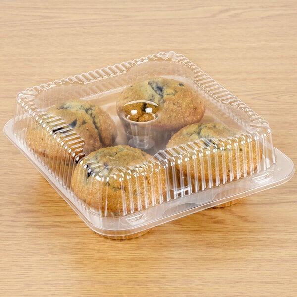 A Polar Pak clear plastic container with a muffin in it.