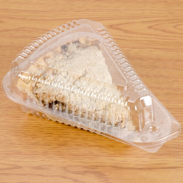 A piece of pie in a Polar Pak clear plastic container with a low dome lid.