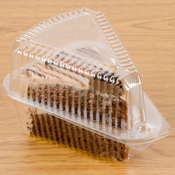 A Polar Pak clear plastic container with a slice of cake inside.