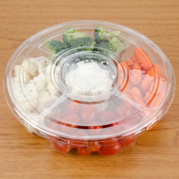 A Polar Pak clear plastic catering tray with 5 compartments, filled with vegetables and dip. One compartment has broccoli.