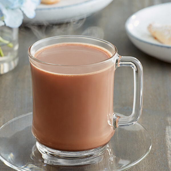 A glass mug of hot chocolate.