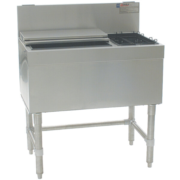 A stainless steel Eagle Group underbar ice chest with bottle racks.