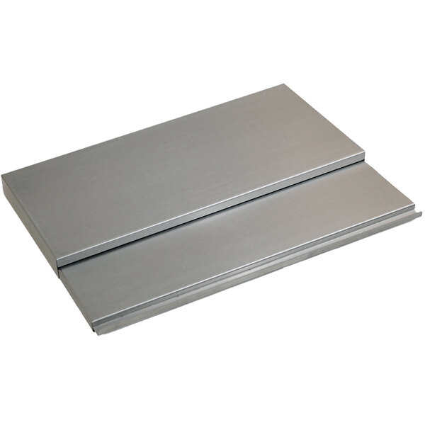 A silver metal cover with two metal plates on top.